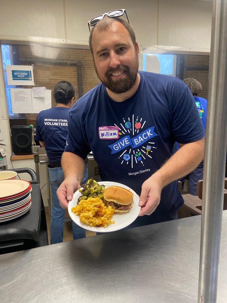 Volunteers serving a meal