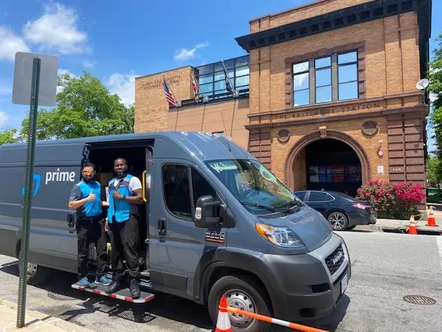 An Amazon delivery van dropping off wishlist donations at The Baltimore Station