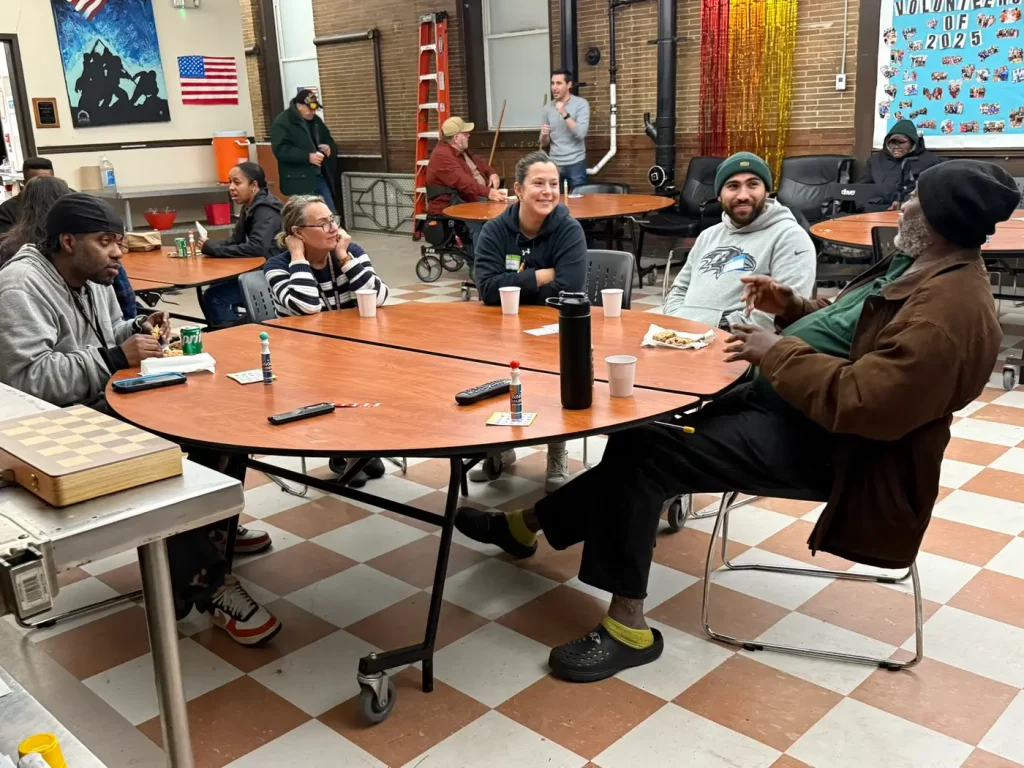 Staff, volunteers and residents together in a common space at The Baltimore Station
