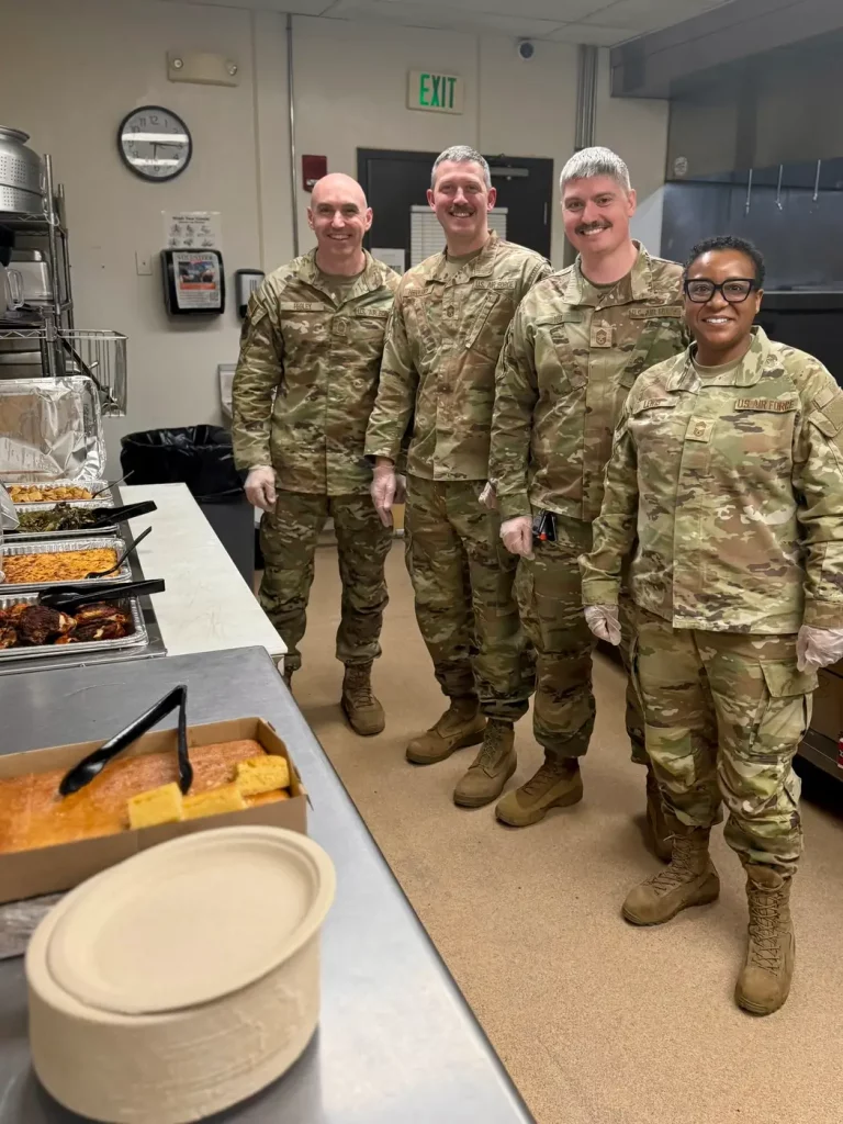 Service members volunteering on the serving line