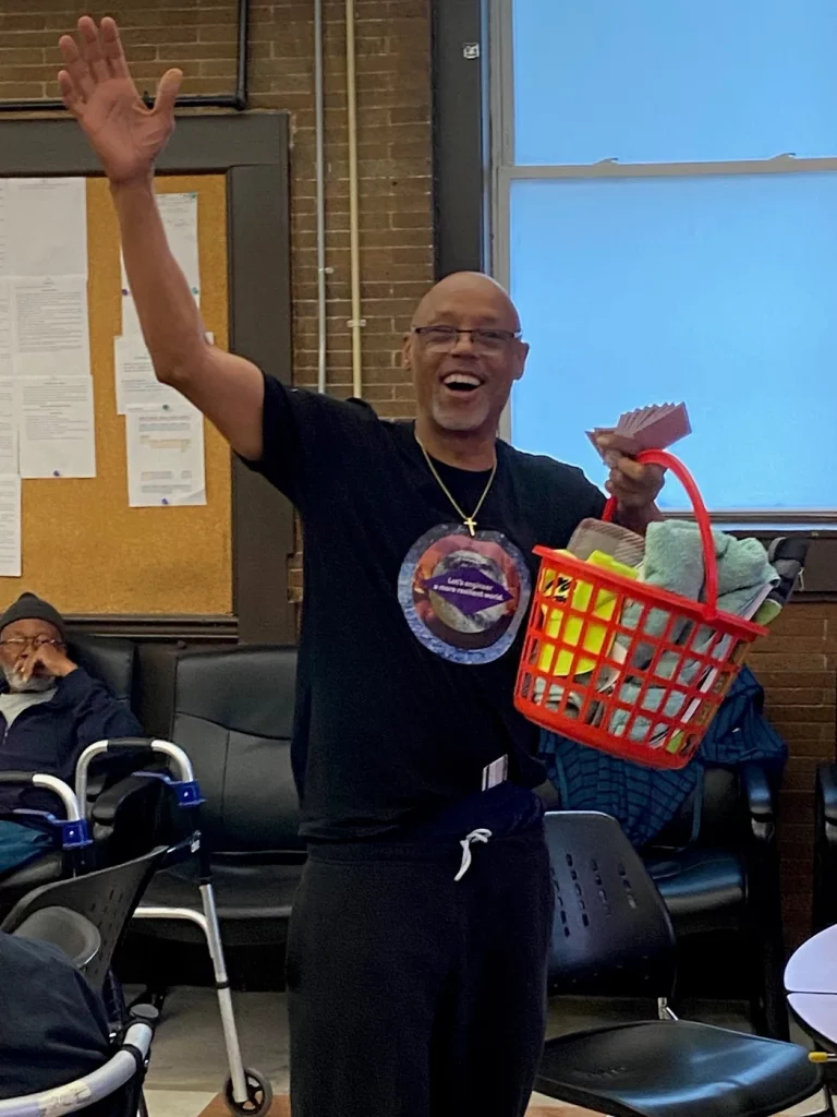 A big raffle winner celebrating at a Baltimore Station event