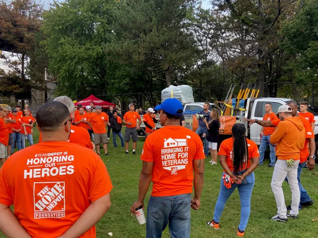 A corporate volunteer team gathering for a service project