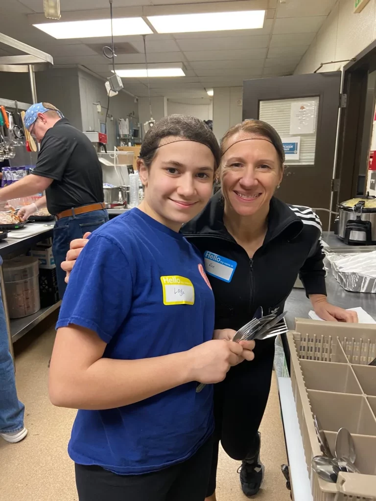 Ree and her daughter volunteering in The Baltimore Station kitchen on her birthday