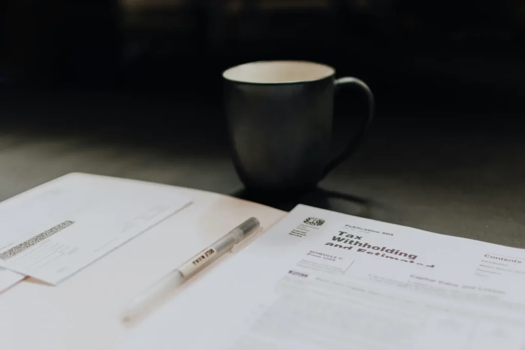 IRS tax forms beside a mug — request a tax letter
